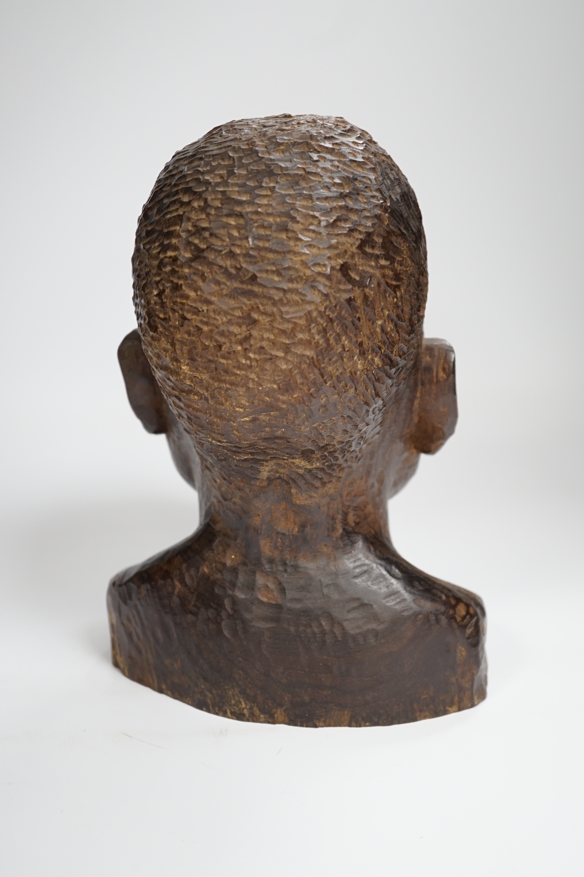 An African carved ebony bust of a gentleman, incised Silas to base, 24cm high